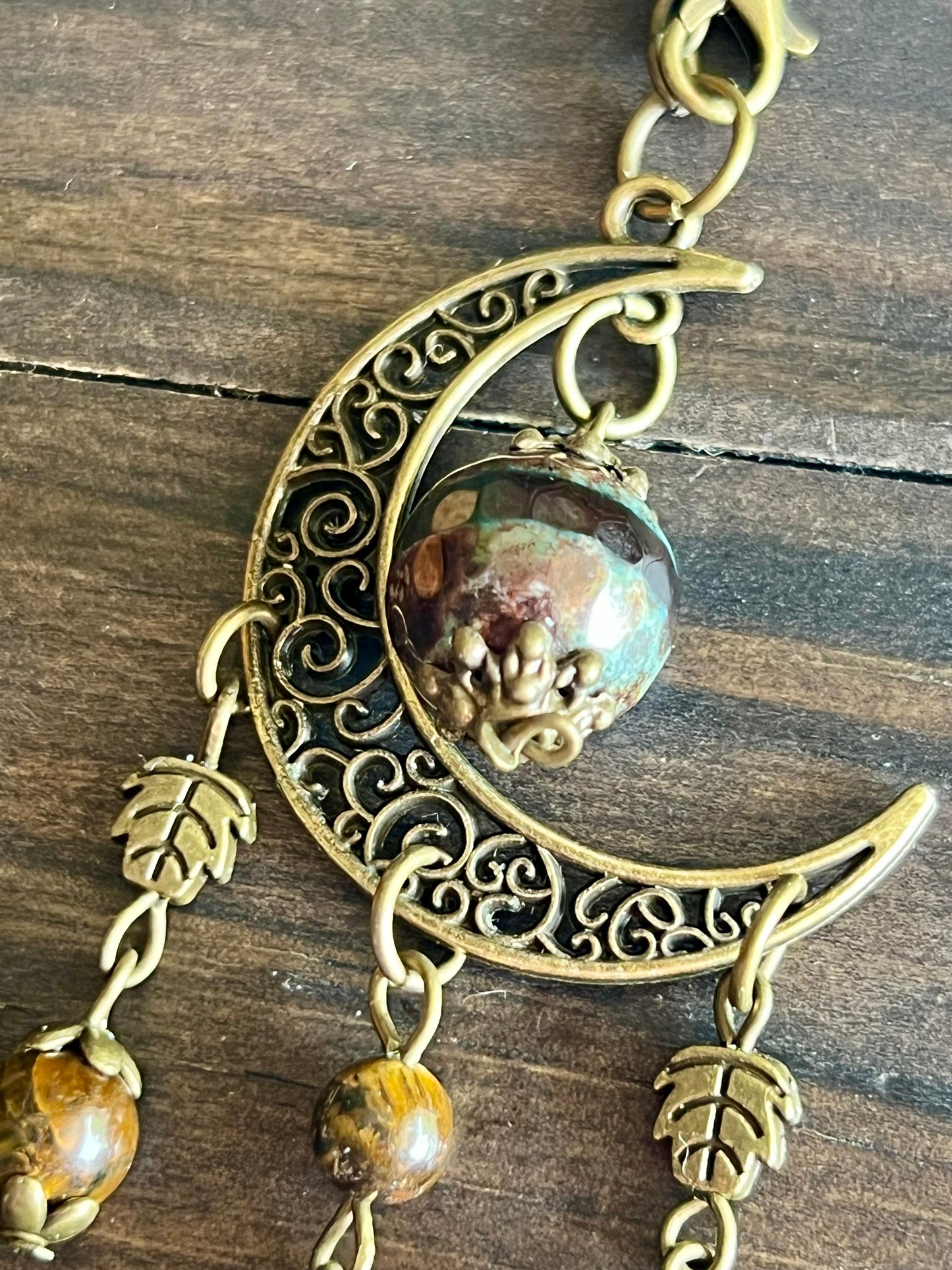 Bronze moon with leafy detailing