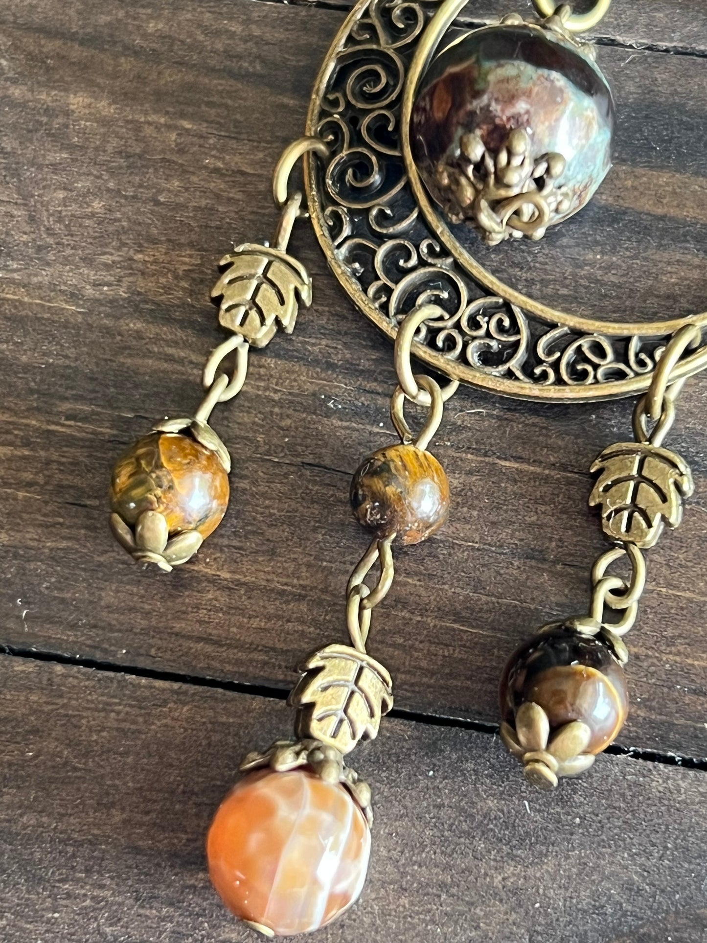 Bronze moon with leafy detailing