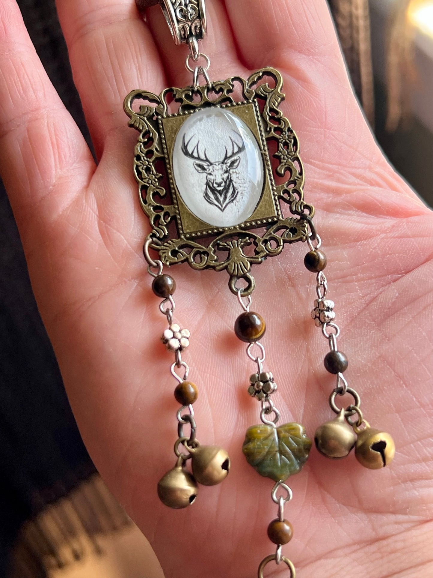 Bronze deer witch bells