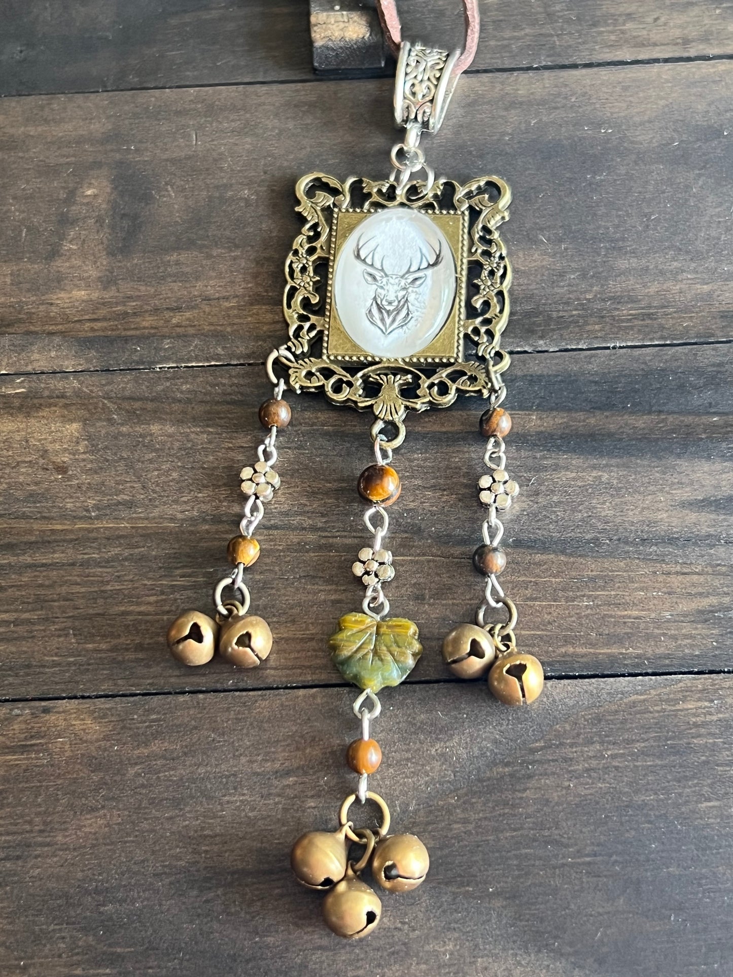 Bronze deer witch bells