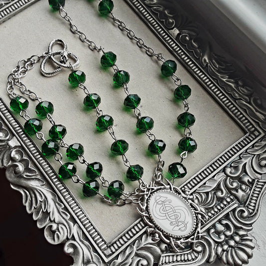 Loki rosary with green crystals