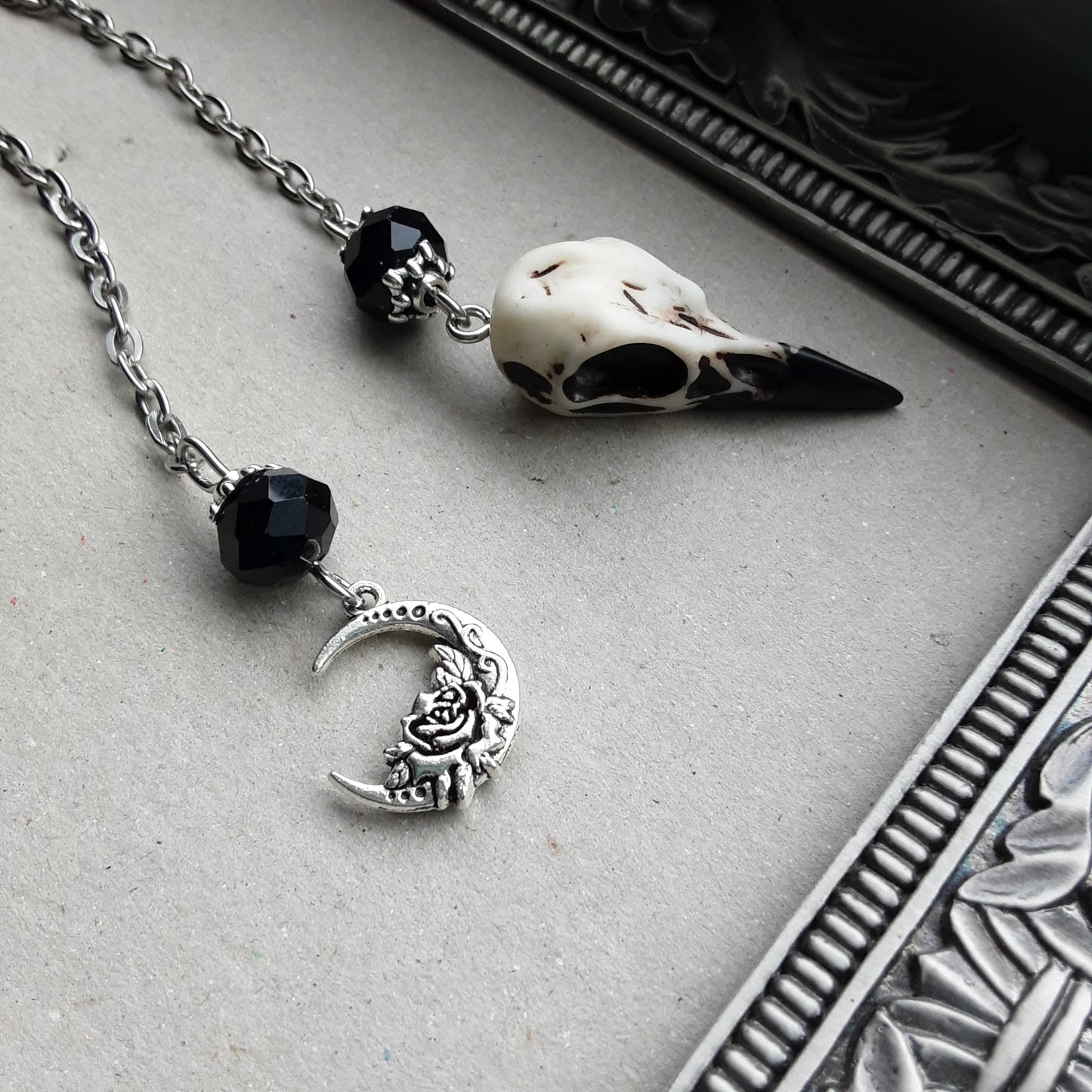 Raven skull pendulum