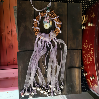 Witch bells with real flowers and purple ribbon