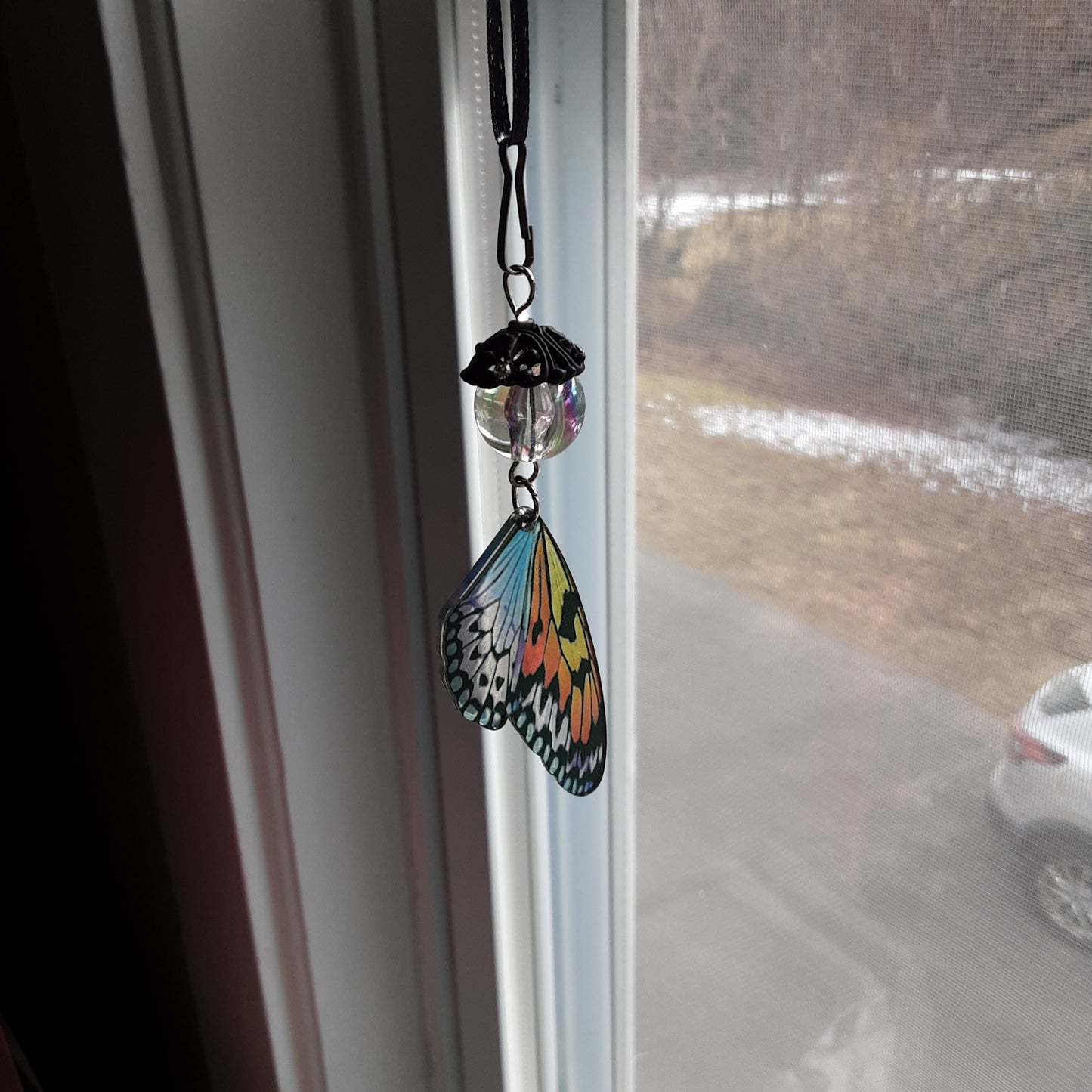 Holographic butterfly wing suncatcher or car mirror hanger