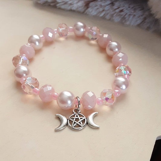 Pink crystal and pearl stretch bracelet with Triple Moon Goddess charm