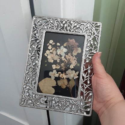 Dried flowers offering in vintage frame