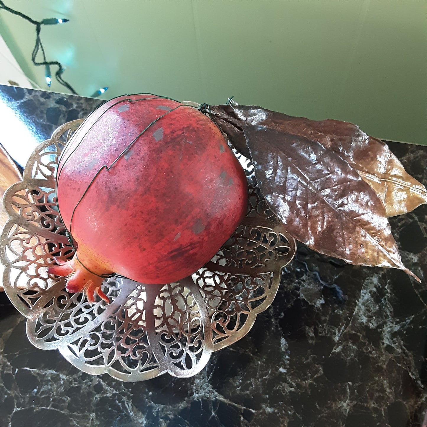 Pomegranate with golden leaves