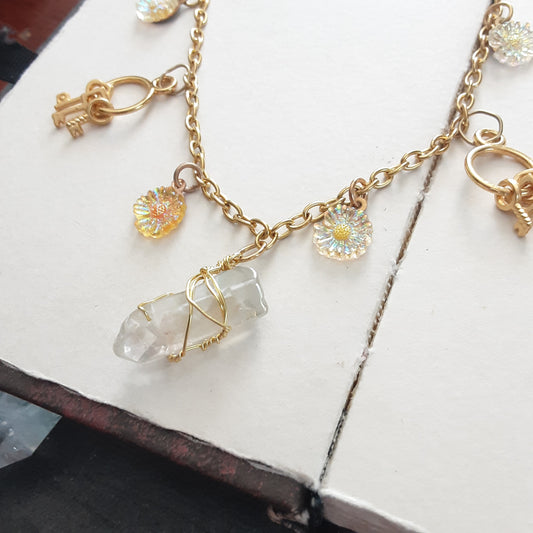 Gold charm necklace with Quartz