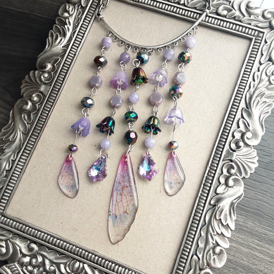 Purple wing fae and flower wall hanging