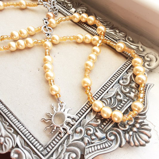 Apollo rosary with yellow faux pearls