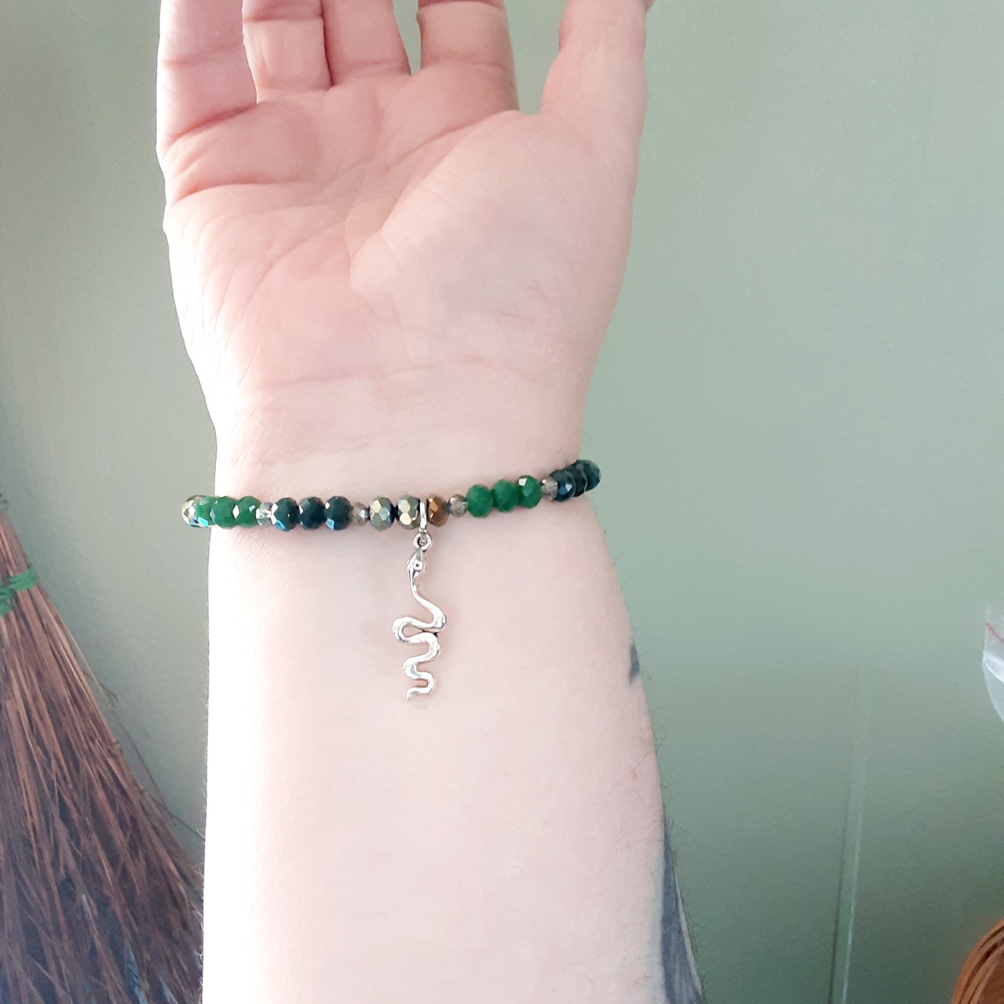 Loki bracelet with snake with various green crystals