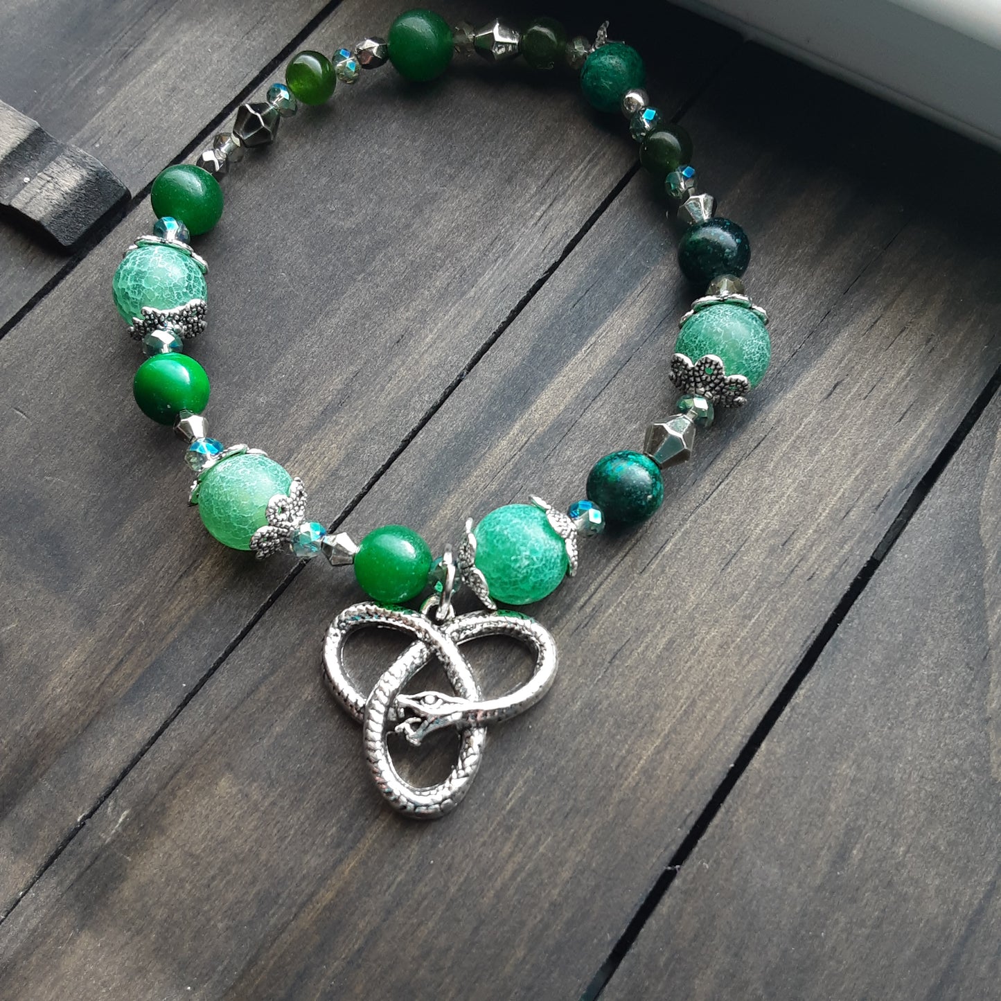 Loki bracelet with knotwork snake charm