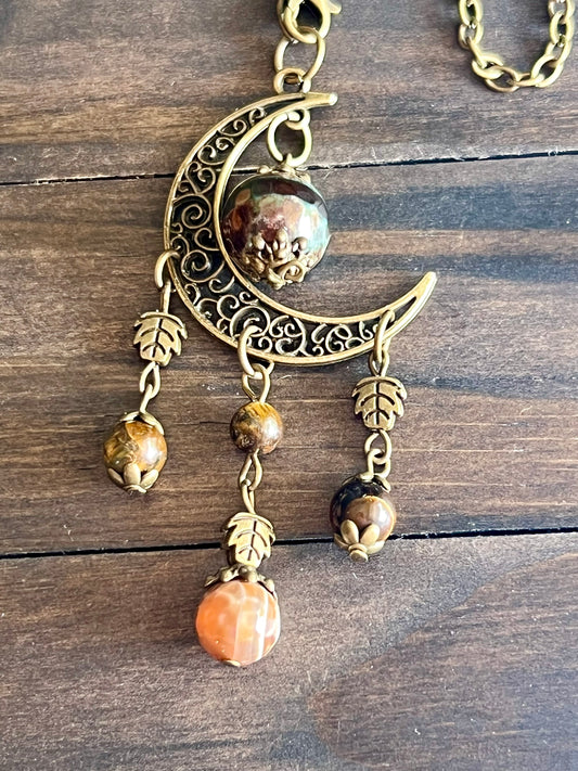 Bronze moon with leafy detailing