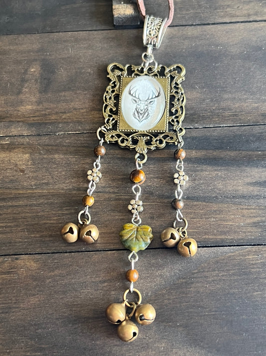Bronze deer witch bells