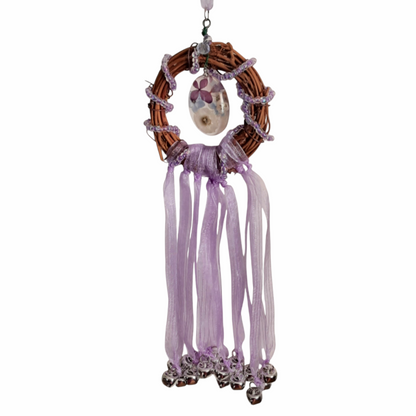 Witch bells with real flowers and purple ribbon