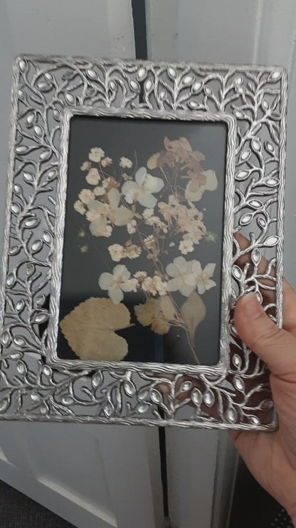 Dried flowers offering in vintage frame